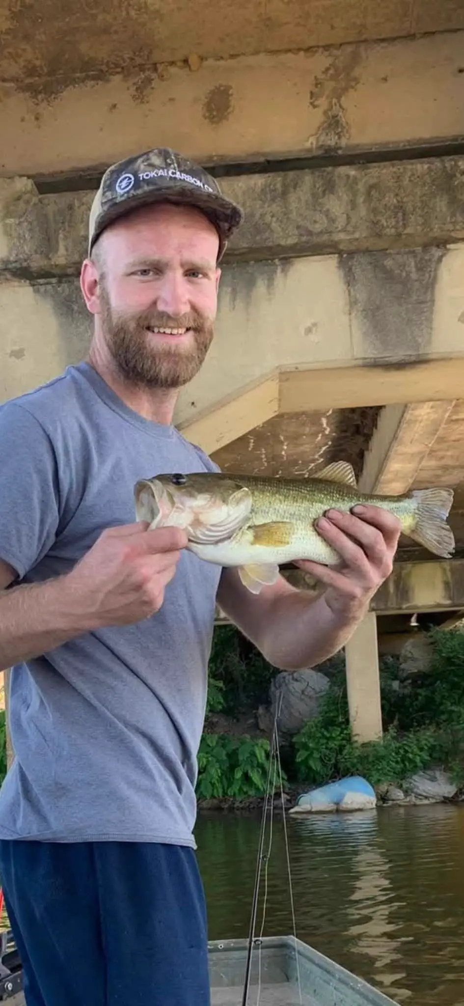 Dakota Davis holding a fish caught with a custom jig