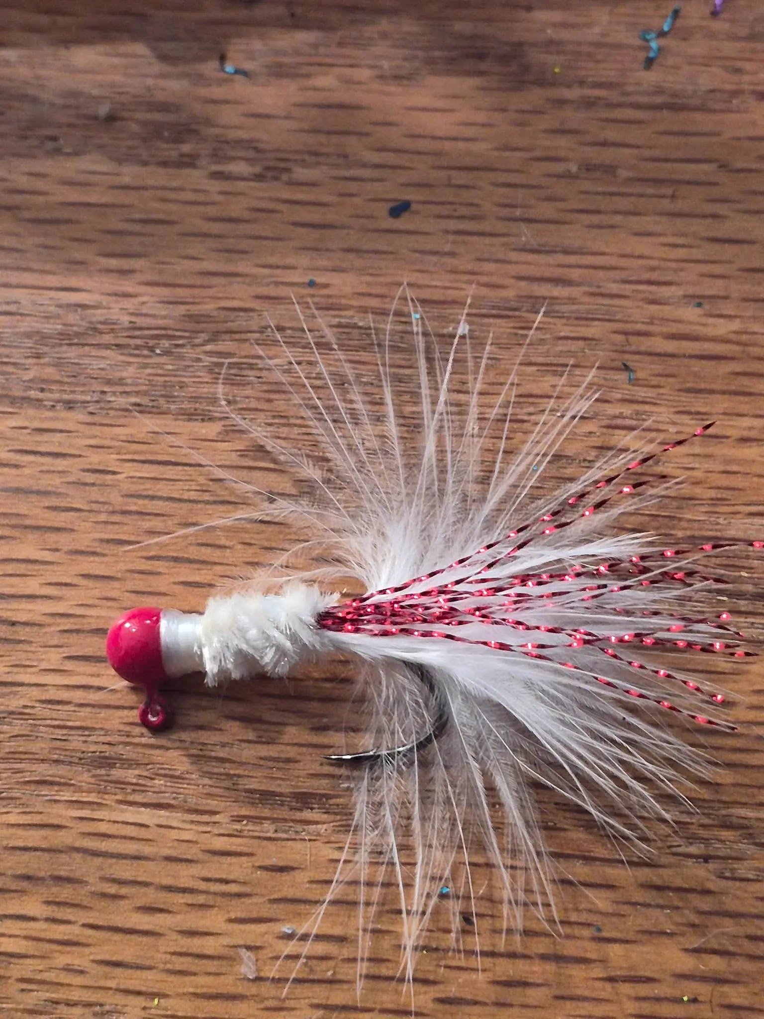Sooner jig — crimson and cream fishing lure
